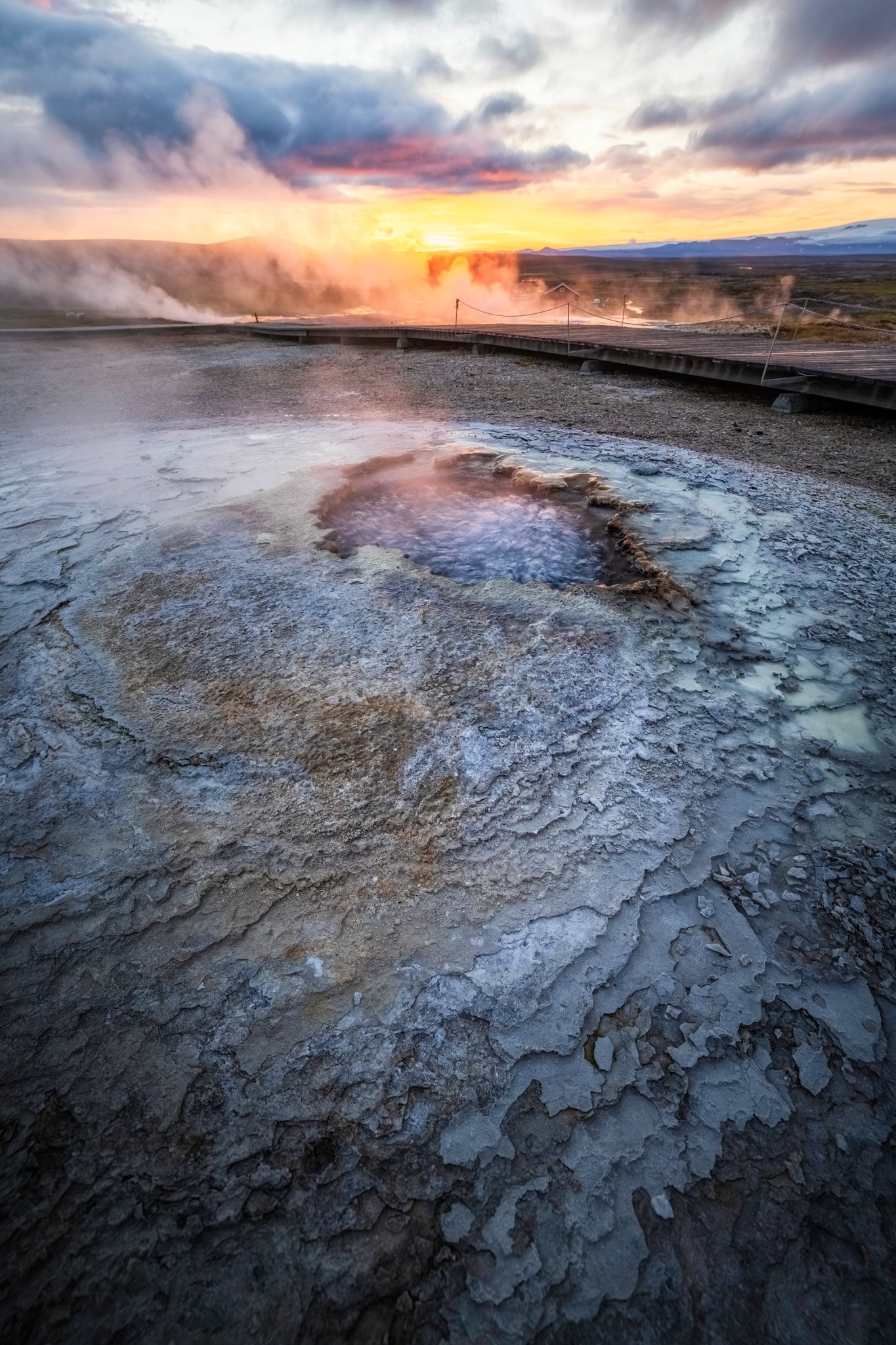 Hveravellir Geothermal area with steam rising at sunset