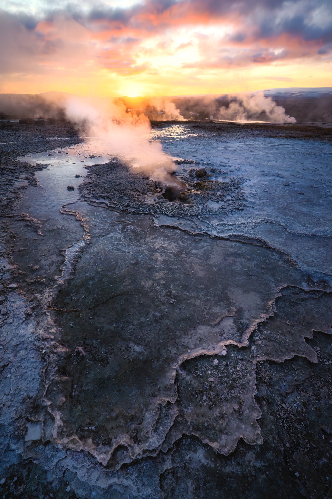 Hveravellir. Geothermal area with steam rising from hot springs at sunset