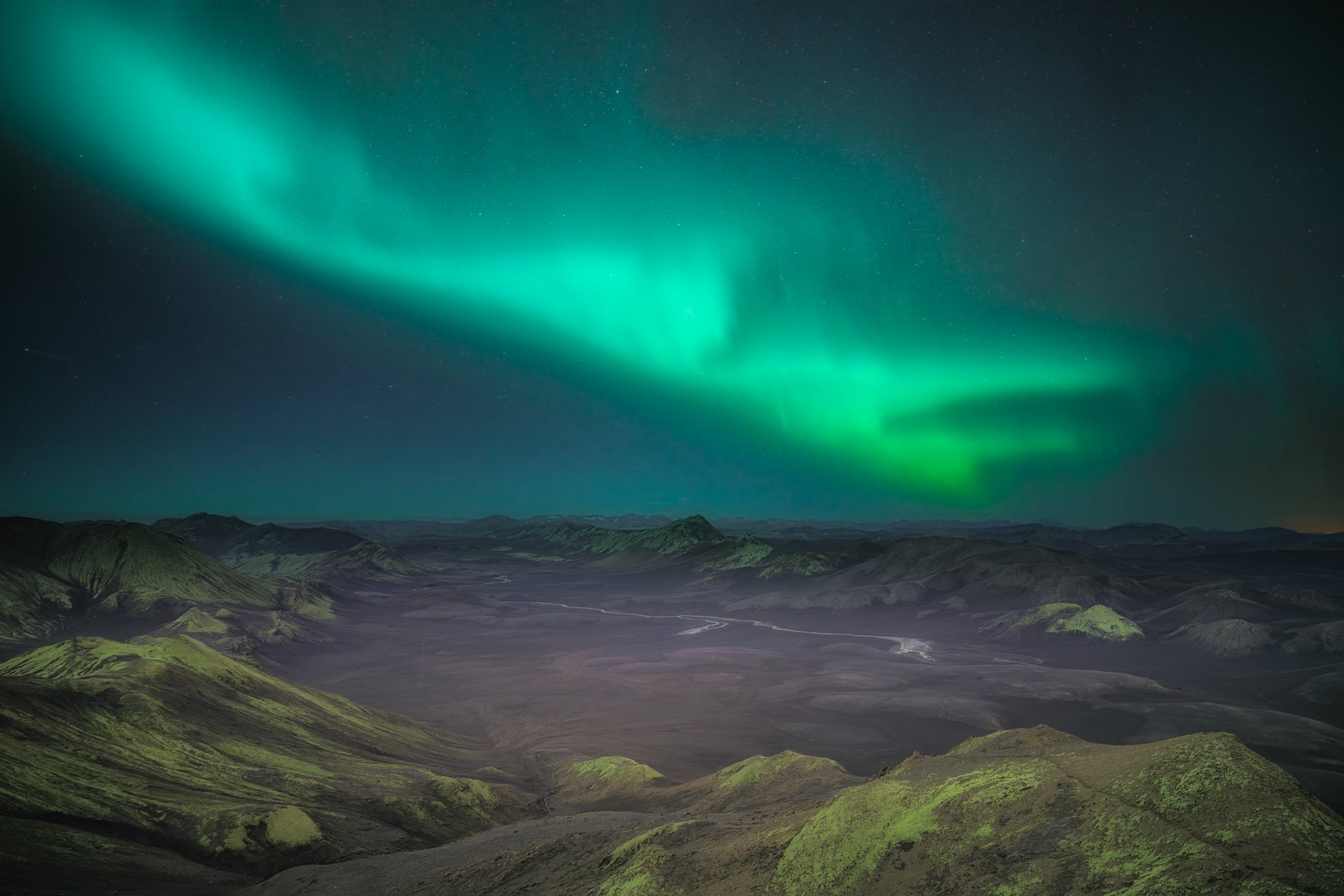 Langisjor Region Iceland Highlands Aurora borealis over a mountainous landscape