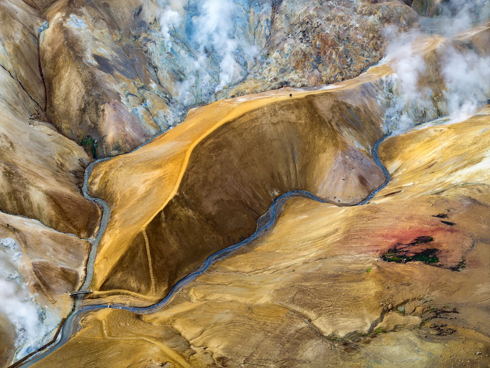 Kerlingarfjoll. Aerial view of a mountainous landscape with a river cutting through it.
