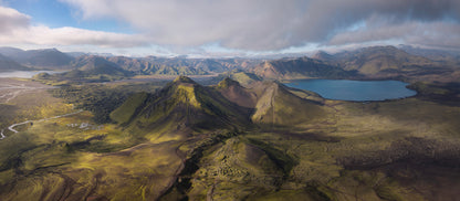 Iceland Highlands. Aerial view of a mountainous landscape with a lake and green valleys.