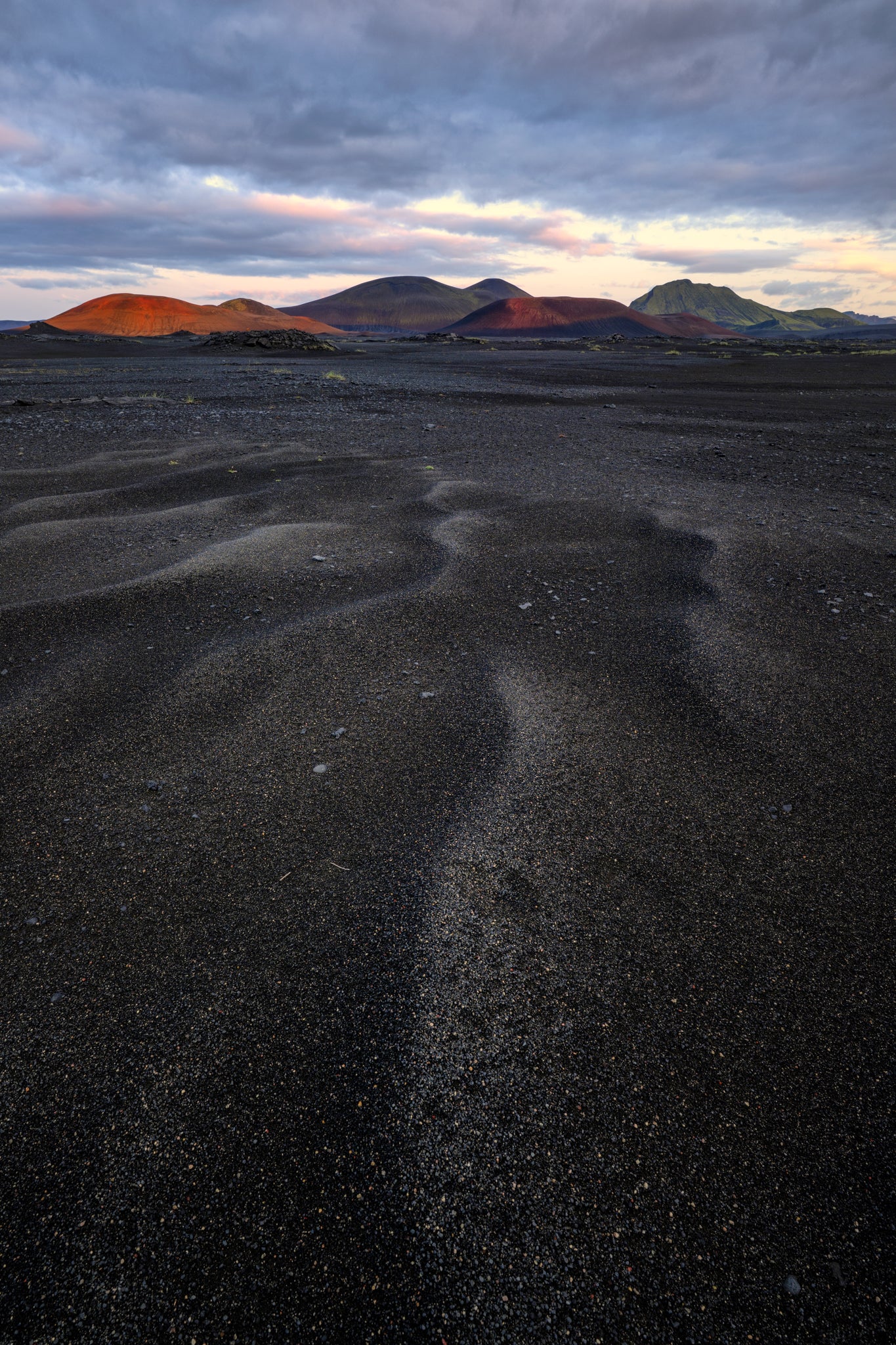 Landmannalaugar. Desert landscape with winding sand patterns and mountains in the background