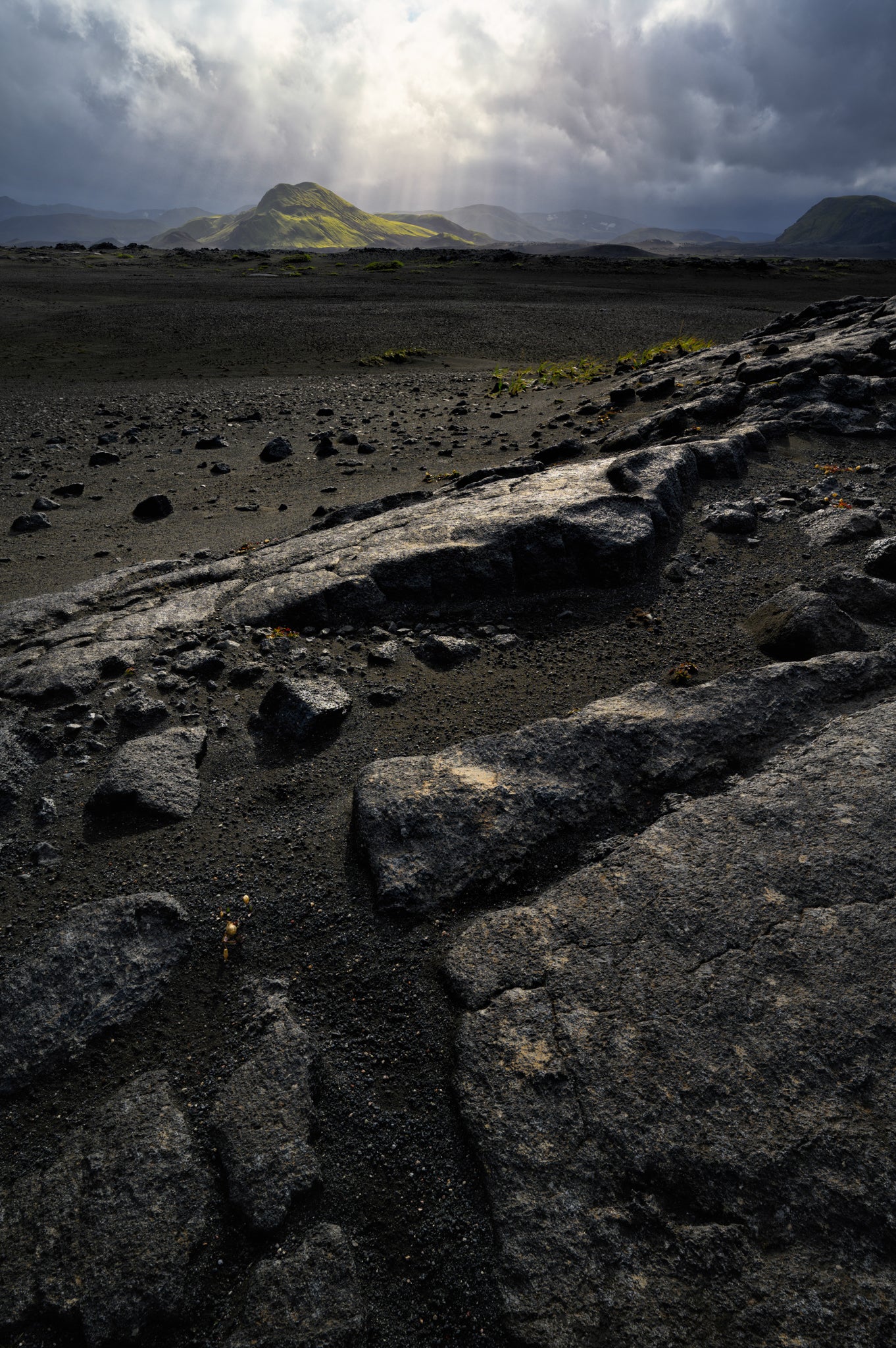 Landmannalaugar Stony landscape with mountains under a cloudy sky
