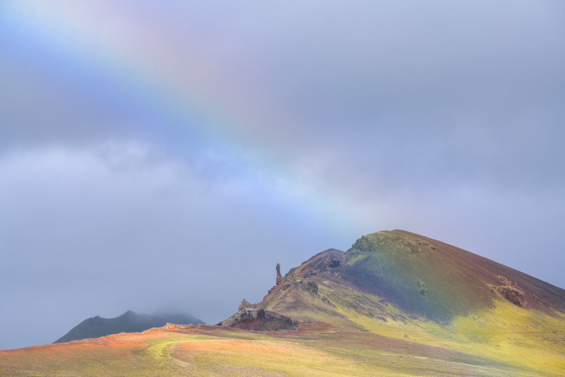 Iceland Highlands. Mountain landscape with a rainbow arching over it
