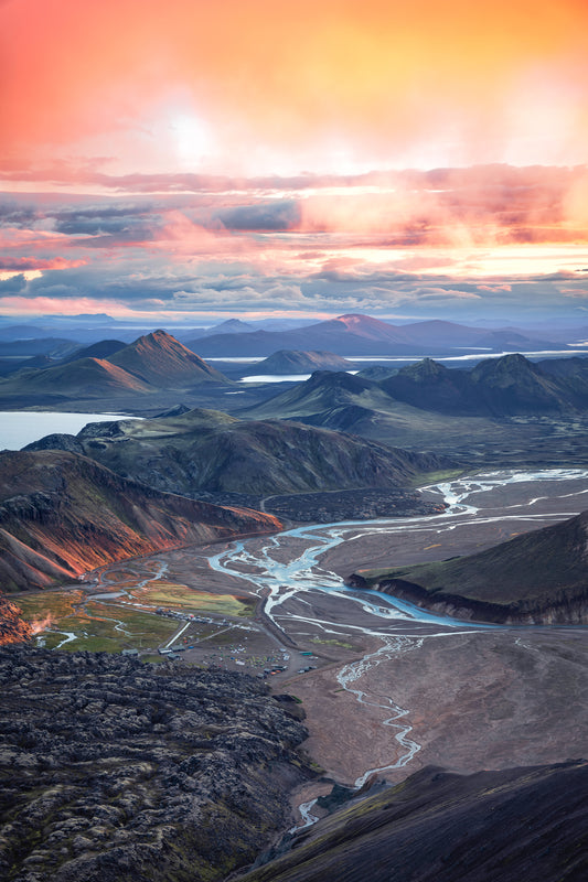 Landmannalaugar. Scenic view of a mountain landscape with a river and colorful sky.